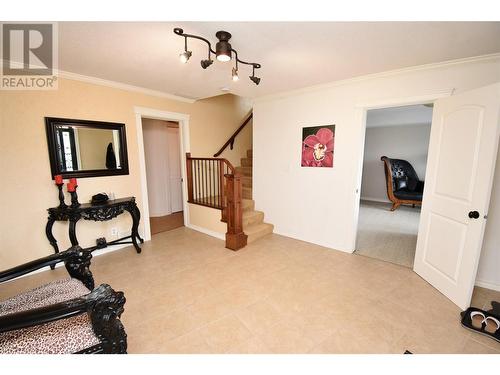 Stairs leading to main level - 9003 Cherry Lane, Coldstream, BC - Indoor Photo Showing Other Room