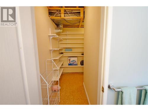 More storage that leads to lower level bathroom - 9003 Cherry Lane, Coldstream, BC - Indoor