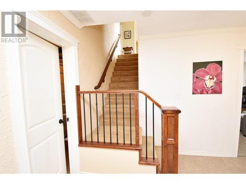 Stairs to main level - 9003 Cherry Lane, Coldstream, BC - Indoor Photo Showing Other Room