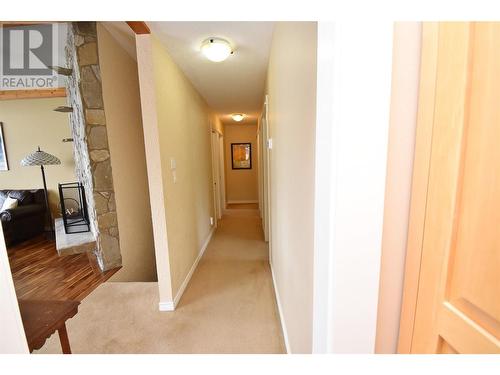Hallway leading to bedrooms - 9003 Cherry Lane, Coldstream, BC - Indoor Photo Showing Other Room