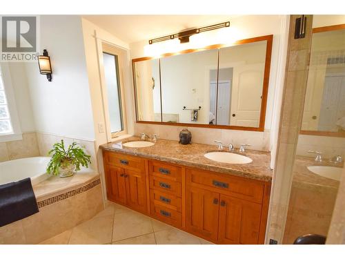 Double vanity - 9003 Cherry Lane, Coldstream, BC - Indoor Photo Showing Bathroom