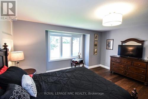 Textured glass door leads you to the living room - 12 - 2684 Mewburn Road, Niagara Falls (Casey), ON - Indoor Photo Showing Bedroom