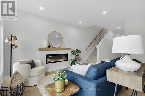195 Bowman Drive, Middlesex Centre (Ilderton), ON - Indoor Photo Showing Living Room With Fireplace