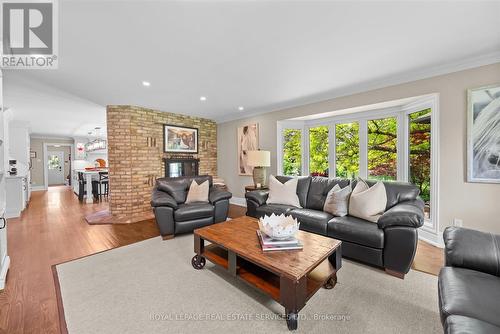 Family Room w/Double-Sided Wood-Burning Fireplace - 2315 8 Sideroad, Burlington, ON - Indoor Photo Showing Living Room