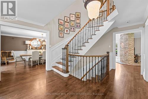 Elegant Hardwood Staircase with Iron Pickets - 2315 8 Sideroad, Burlington, ON - Indoor Photo Showing Other Room