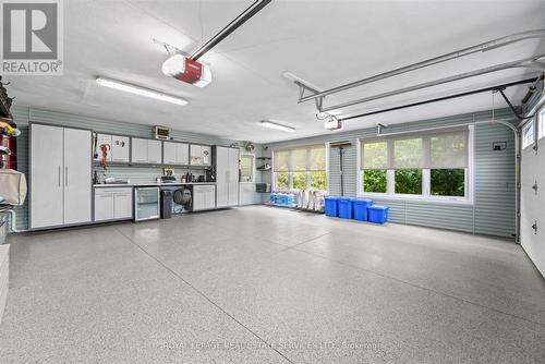 Garage w/Epoxy Floor & Built-In Storage Solutions - 2315 8 Sideroad, Burlington, ON - Indoor Photo Showing Garage