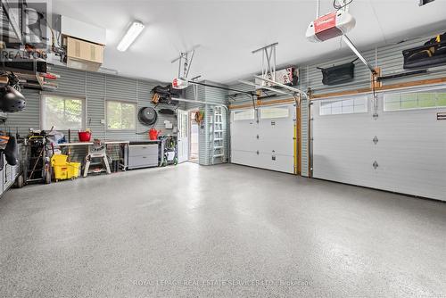 Garage w/Epoxy Floor & Built-In Storage Solutions - 2315 8 Sideroad, Burlington, ON - Indoor Photo Showing Garage