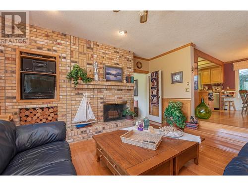 9178 Clancy Frontage Road, Mara, BC - Indoor Photo Showing Living Room With Fireplace