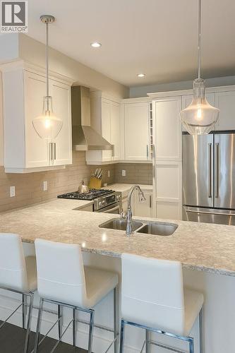 644 Lequime Road Unit# 2, Kelowna, BC - Indoor Photo Showing Kitchen With Double Sink With Upgraded Kitchen