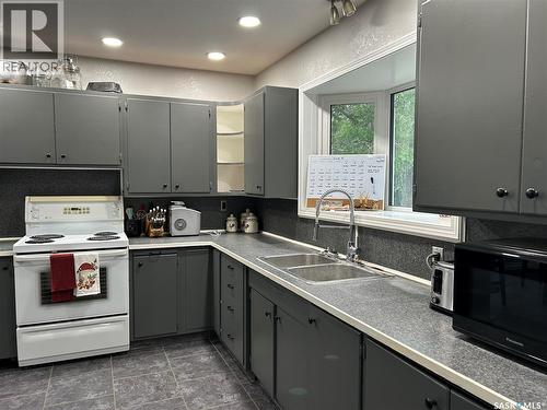 516 First Avenue E, Lampman, SK - Indoor Photo Showing Kitchen With Double Sink