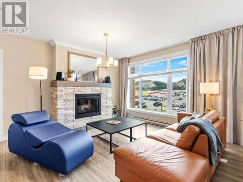 206-36 Waterfront Place, Whitehorse, YT - Indoor Photo Showing Living Room With Fireplace