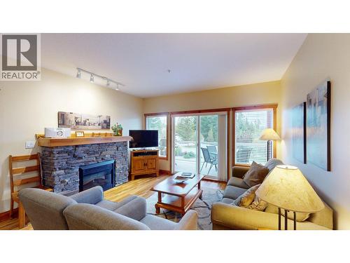 701 14A Crescent Unit# 213 I, Invermere, BC - Indoor Photo Showing Living Room With Fireplace