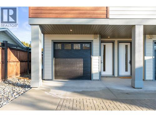 Front Door and Tandem Garage - 3907 26 Street Unit# 1, Vernon, BC - Outdoor With Deck Patio Veranda With Exterior
