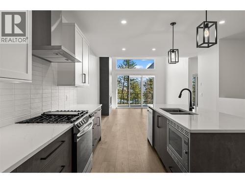2 bed | 2 flex | 3 baths | 2418 sqft | Slate colour scheme. Photos taken from similar home in the community. - 2835 Canyon Crest Drive Unit# 7, West Kelowna, BC - Indoor Photo Showing Kitchen With Double Sink With Upgraded Kitchen