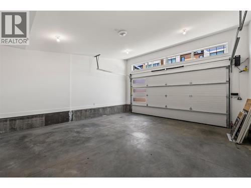 Double car garage. Photos taken from similar home in the community. - 2835 Canyon Crest Drive Unit# 7, West Kelowna, BC - Indoor Photo Showing Garage