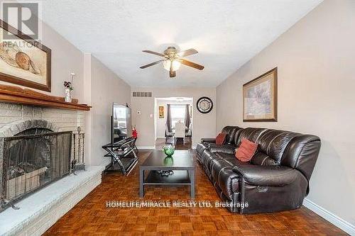 73 - 7080 Copenhagen Road, Mississauga, ON - Indoor Photo Showing Living Room With Fireplace