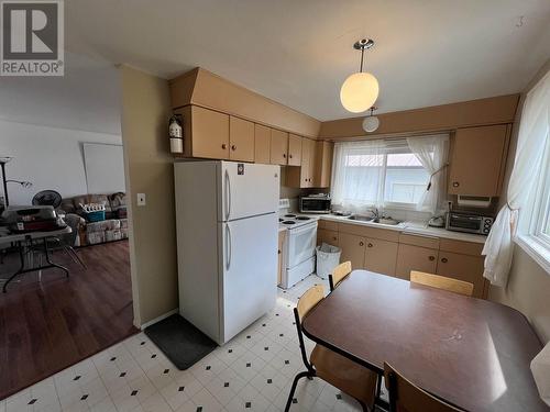 5527 48 Street, Fort Nelson, BC - Indoor Photo Showing Kitchen With Double Sink