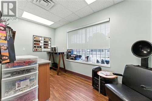 Office space featuring a drop ceiling and wood finished floors - 207 Greenwich Street, Brantford, ON 