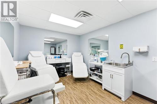 Office featuring light wood-type flooring and a paneled ceiling - 207 Greenwich Street, Brantford, ON 