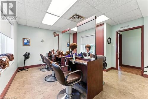 Office space featuring a drop ceiling and light flooring - 207 Greenwich Street, Brantford, ON 