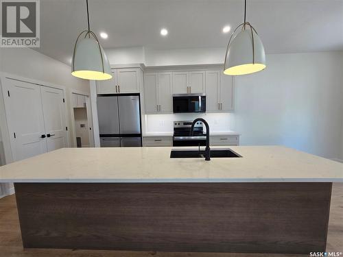 44 Kenney Crescent, Weyburn, SK - Indoor Photo Showing Kitchen With Double Sink With Upgraded Kitchen