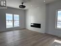 720 Weir Crescent, Warman, SK  - Indoor Photo Showing Living Room With Fireplace 