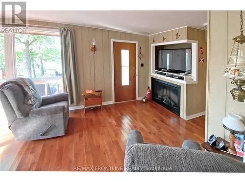 41 Sand-Birch Island, Rideau Lakes, ON - Indoor Photo Showing Living Room With Fireplace