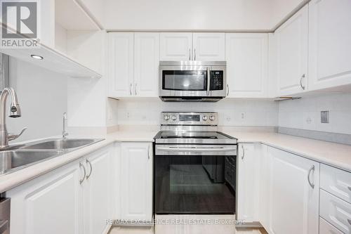 Gv202 - 320 City  Centre Drive, Mississauga, ON - Indoor Photo Showing Kitchen With Double Sink