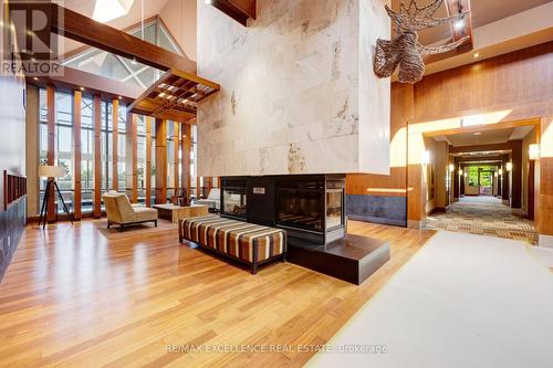 Gv202 - 320 City  Centre Drive, Mississauga, ON - Indoor With Fireplace