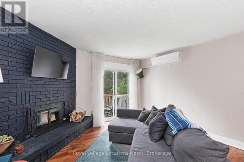 Unit 18 - 209472 26 Highway, Blue Mountains, ON - Indoor Photo Showing Living Room With Fireplace