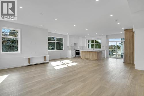 Photos may be of a similar home in the community - 5300 Main Street Unit# 124, Kelowna, BC - Indoor Photo Showing Living Room