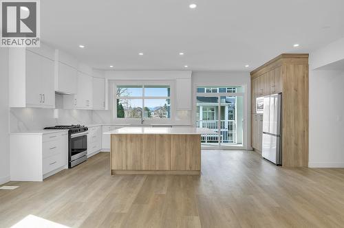 Photos may be of a similar home in the community - 5300 Main Street Unit# 124, Kelowna, BC - Indoor Photo Showing Kitchen With Upgraded Kitchen