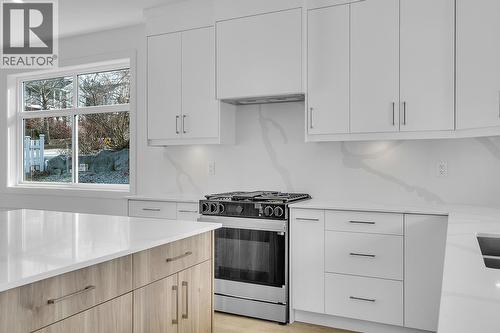 Photos may be of a similar home in the community - 5300 Main Street Unit# 124, Kelowna, BC - Indoor Photo Showing Kitchen With Upgraded Kitchen