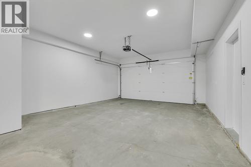 Photos may be of a similar home in the community - 5300 Main Street Unit# 124, Kelowna, BC - Indoor Photo Showing Garage
