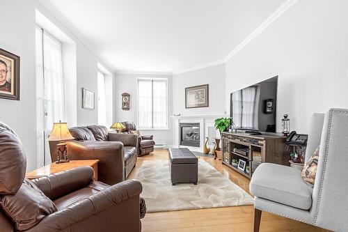 Living room - 1-12 Côte De La Canoterie, Québec (La Cité-Limoilou), QC - Indoor Photo Showing Living Room With Fireplace