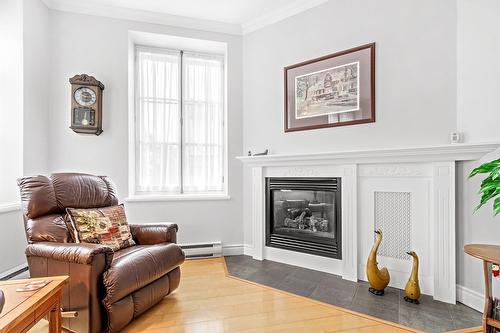 Living room - 1-12 Côte De La Canoterie, Québec (La Cité-Limoilou), QC - Indoor Photo Showing Living Room With Fireplace
