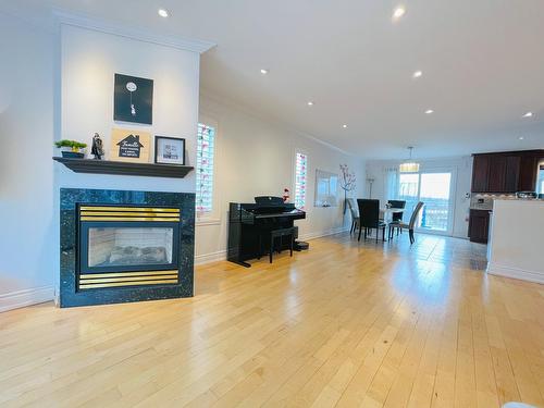 Living room - 2104 Rue De Renaix, Laval (Vimont), QC - Indoor Photo Showing Living Room With Fireplace
