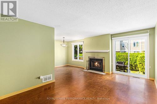 Living and Dining Rooms w/fireplace - 2015 Summerfields Crescent, Ottawa, ON - Indoor Photo Showing Living Room With Fireplace