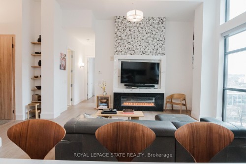 Lph13-118 King Street E, Hamilton, ON - Indoor Photo Showing Living Room With Fireplace