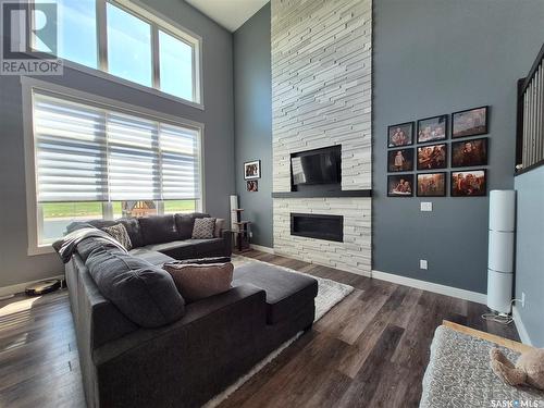 836 Mctaggart Drive, Weyburn, SK - Indoor Photo Showing Living Room With Fireplace