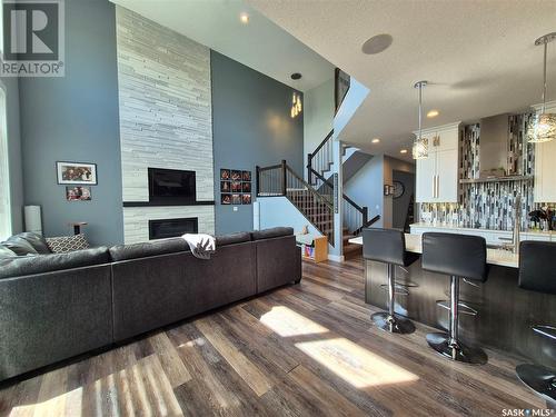 836 Mctaggart Drive, Weyburn, SK - Indoor Photo Showing Living Room With Fireplace