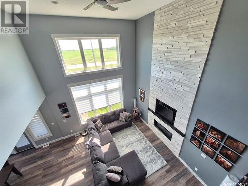 836 Mctaggart Drive, Weyburn, SK - Indoor Photo Showing Other Room With Fireplace
