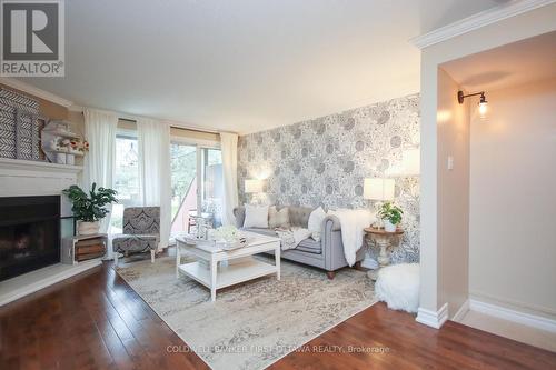 A - 6702 Jeanne D'Arc Boulevard, Ottawa, ON - Indoor Photo Showing Living Room With Fireplace