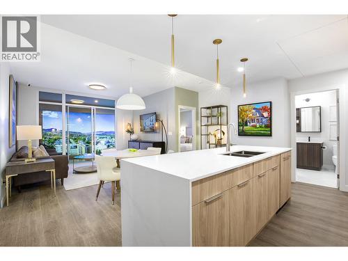 Photo is of our show suite located at 238 4th Avenue in Downtown Kamloops, open daily 11-3. Finishing, room sizes and colours subject to change. - 460 Nicola Street Unit# 2203, Kamloops, BC - Indoor Photo Showing Kitchen With Double Sink
