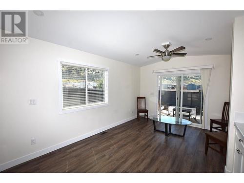 Living room area with sliders to the back deck - 57 Antoine Road Unit# 9, Vernon, BC 