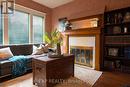 111 Park Row N, Hamilton, ON  - Indoor With Fireplace 