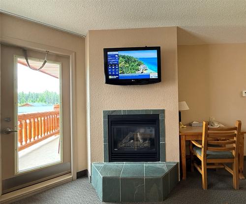 208-500 Stemwinder Drive, Kimberley, BC - Indoor Photo Showing Other Room With Fireplace