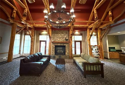 208-500 Stemwinder Drive, Kimberley, BC - Indoor Photo Showing Living Room With Fireplace