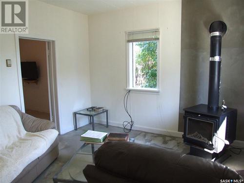 150 2Nd Street E, Fox Valley, SK - Indoor With Fireplace