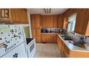9016 Lyman Drive, Dawson Creek, BC  - Indoor Photo Showing Kitchen With Double Sink 